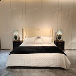 Cream Leather Upholstered Bed with Dark Natural Wood Veneer Trim, Embossed Brand Emblem & Copper-Accented Hardware